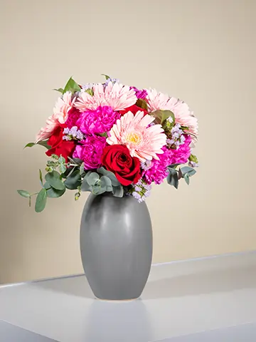 Bouquet gerbere rosa garofani fucsia rose rosse